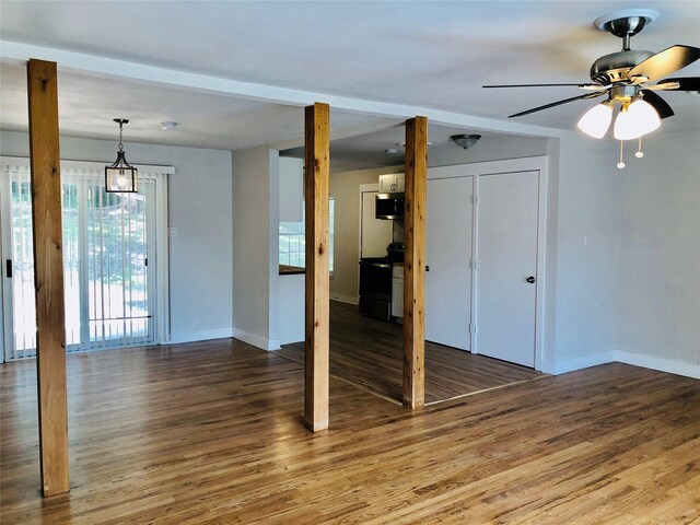 spare room featuring hardwood / wood-style floors and ceiling fan