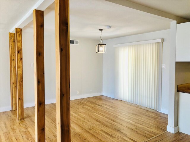 unfurnished dining area featuring light hardwood / wood-style floors