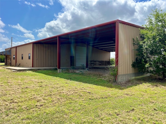 view of outbuilding with a lawn