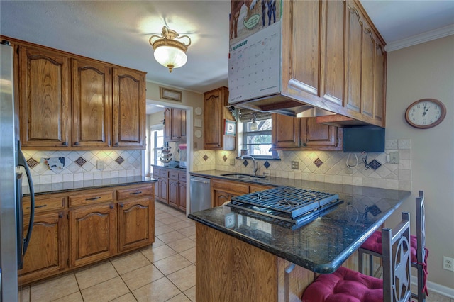 kitchen featuring light tile patterned flooring, backsplash, stainless steel appliances, ornamental molding, and sink