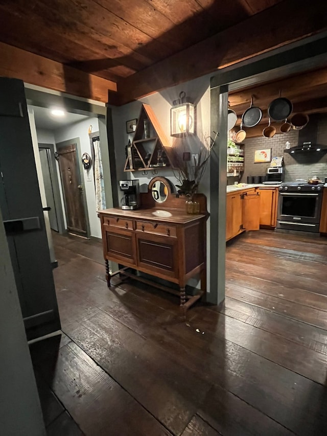 corridor with wood ceiling, beamed ceiling, and dark hardwood / wood-style flooring