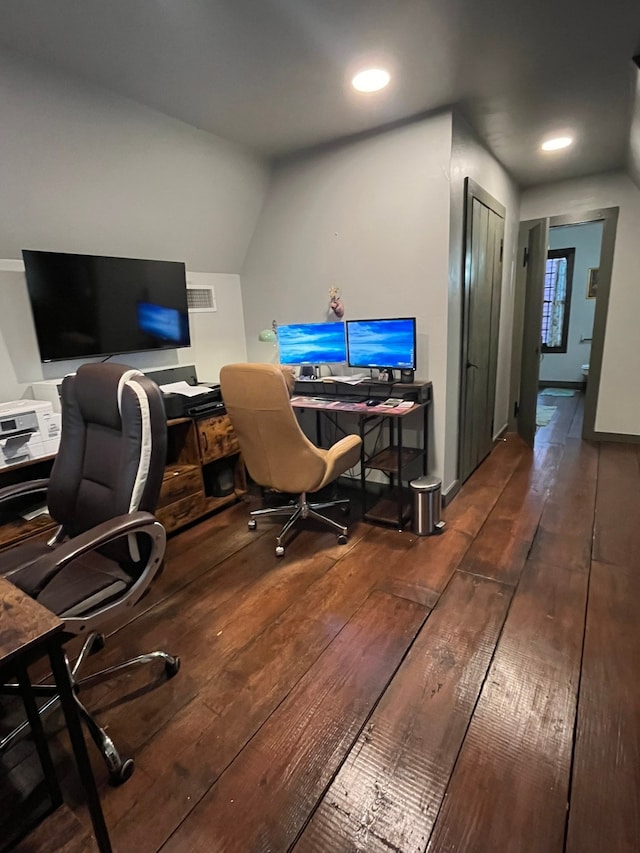 office space featuring vaulted ceiling and dark hardwood / wood-style flooring