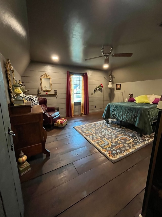 bedroom with lofted ceiling, hardwood / wood-style flooring, and ceiling fan