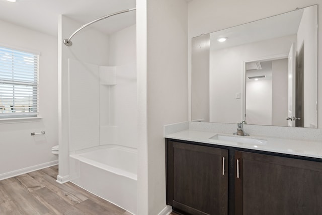 full bathroom featuring shower / bathing tub combination, vanity, toilet, and wood-type flooring