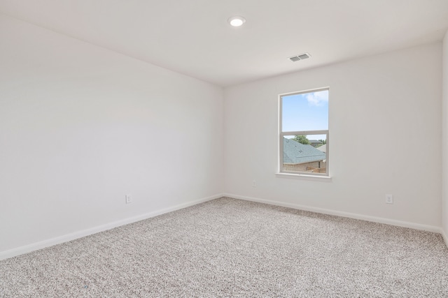 spare room featuring carpet flooring