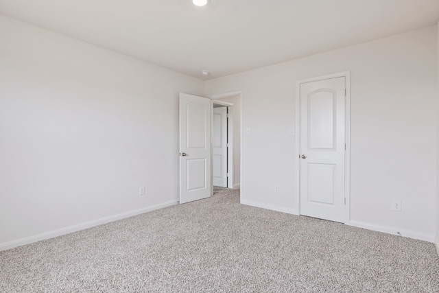 spare room featuring carpet floors