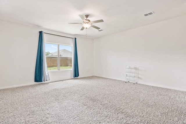 unfurnished room with carpet flooring and ceiling fan