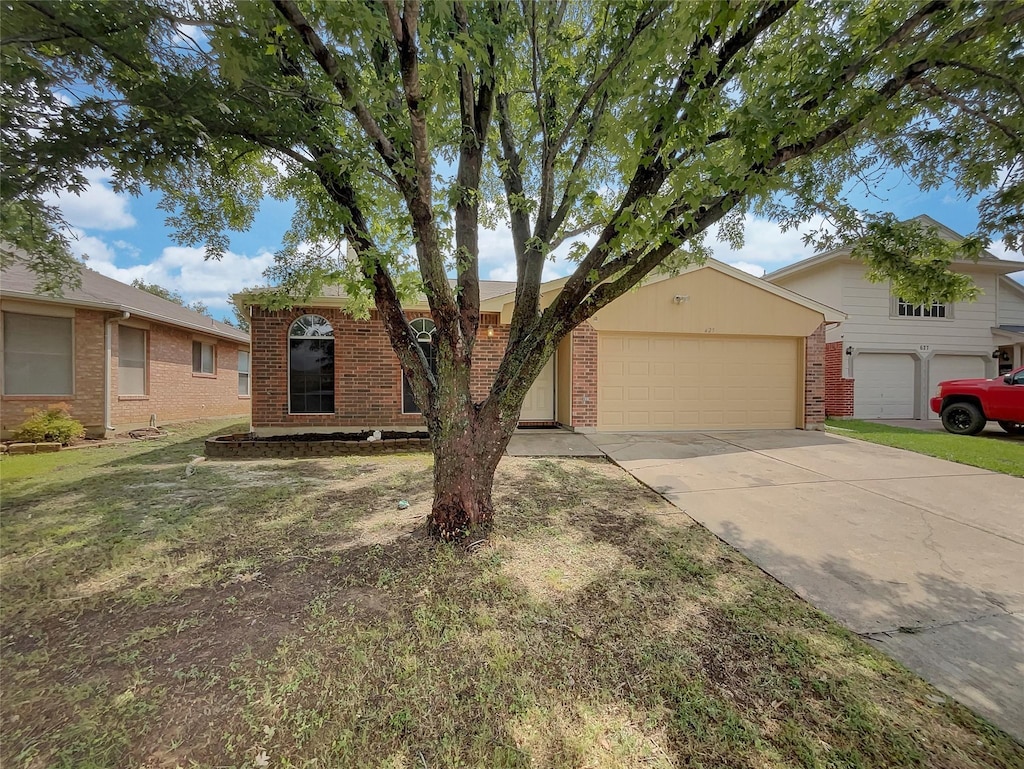 single story home featuring a front yard and a garage