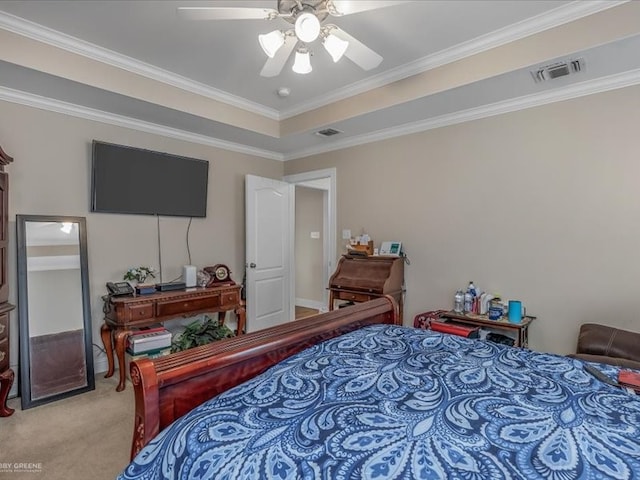 bedroom featuring ceiling fan, ornamental molding, and light colored carpet