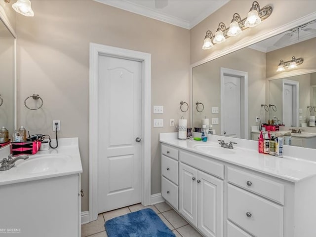 bathroom featuring tile patterned flooring, double sink vanity, and crown molding