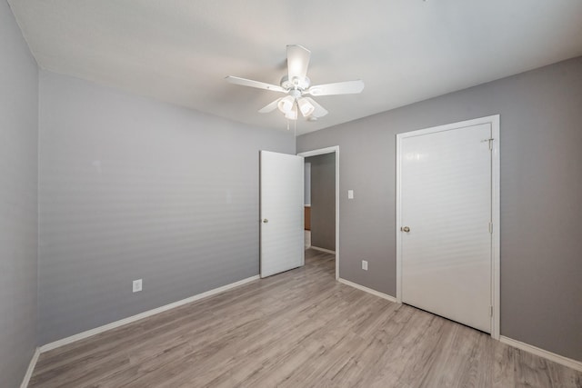 unfurnished bedroom featuring light hardwood / wood-style flooring and ceiling fan