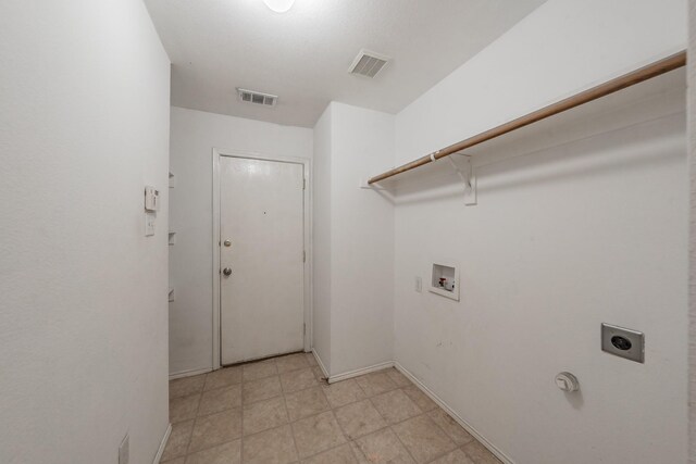 laundry room with light tile patterned flooring, hookup for an electric dryer, and hookup for a washing machine