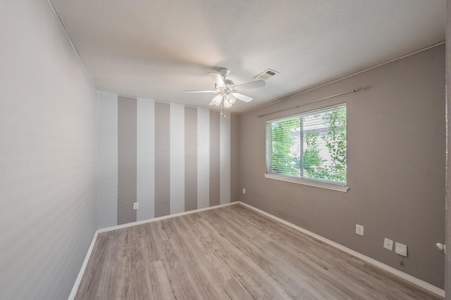 unfurnished room featuring ceiling fan and light hardwood / wood-style floors