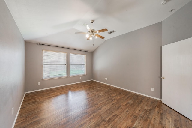 unfurnished room featuring dark hardwood / wood-style flooring, lofted ceiling, and ceiling fan