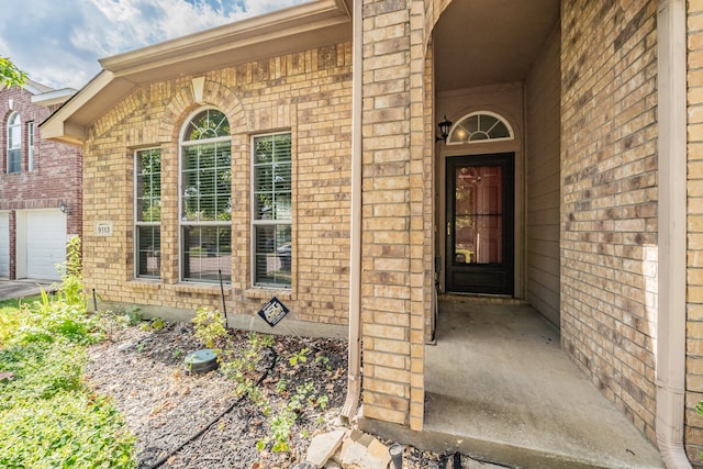 property entrance with a garage