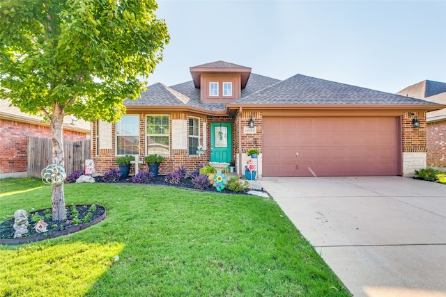 prairie-style house featuring a front yard and a garage