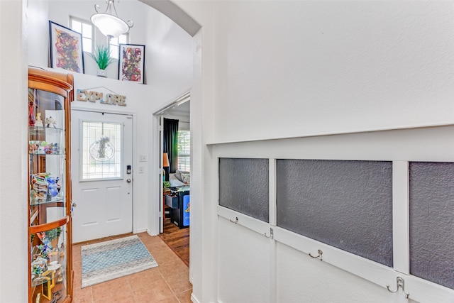 entryway with light tile patterned floors