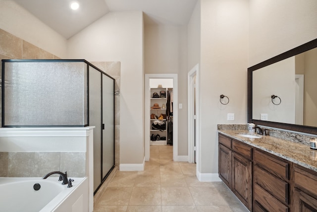 bathroom featuring vanity, high vaulted ceiling, tile patterned floors, and separate shower and tub