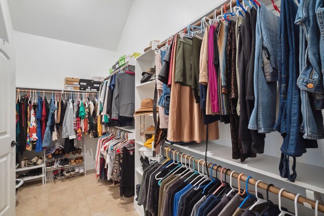 walk in closet featuring light tile patterned flooring