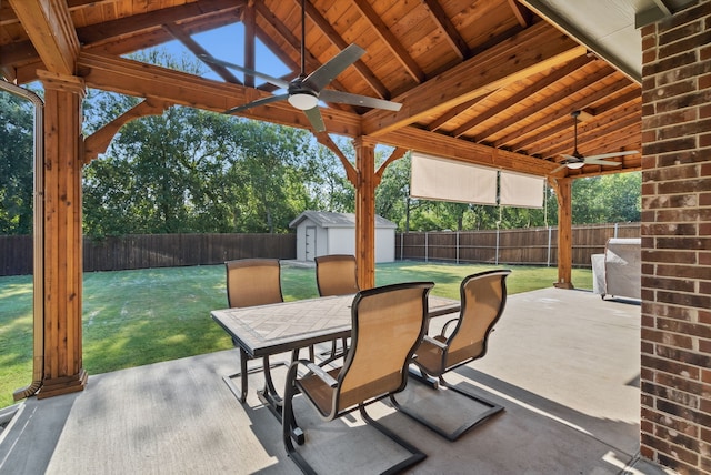 view of patio / terrace featuring a shed and ceiling fan