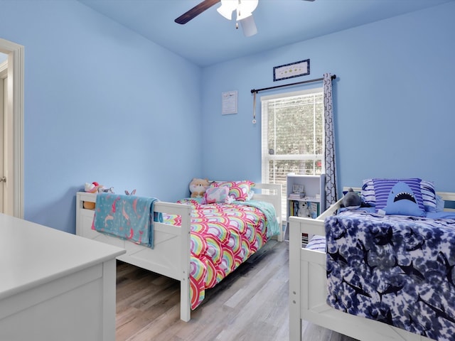 bedroom featuring light hardwood / wood-style flooring and ceiling fan