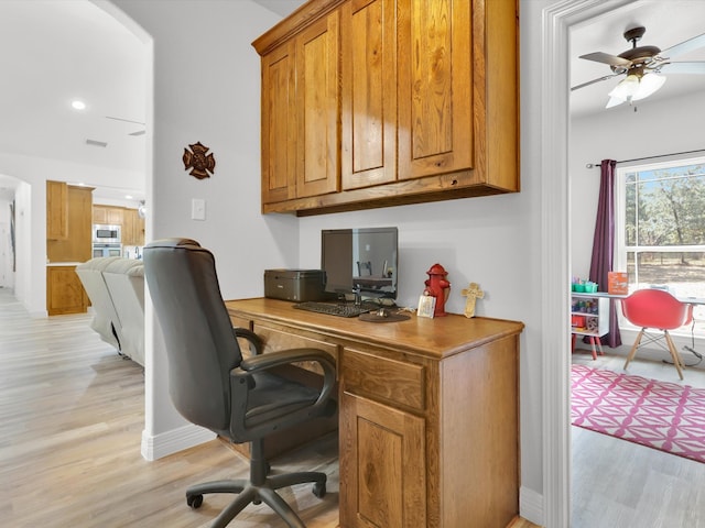 office space with ceiling fan and light hardwood / wood-style floors