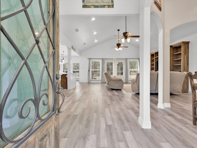 entrance foyer featuring high vaulted ceiling, light hardwood / wood-style flooring, and ceiling fan