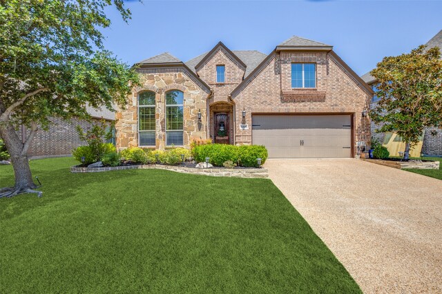 view of front facade featuring a garage and a front lawn