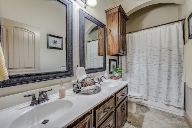 full bathroom with shower / tub combo, toilet, tile patterned flooring, and double sink vanity