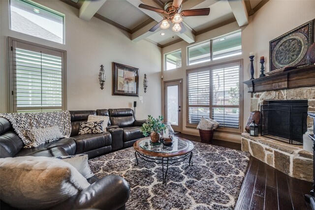 living room featuring a fireplace, beam ceiling, ceiling fan, wood-type flooring, and coffered ceiling