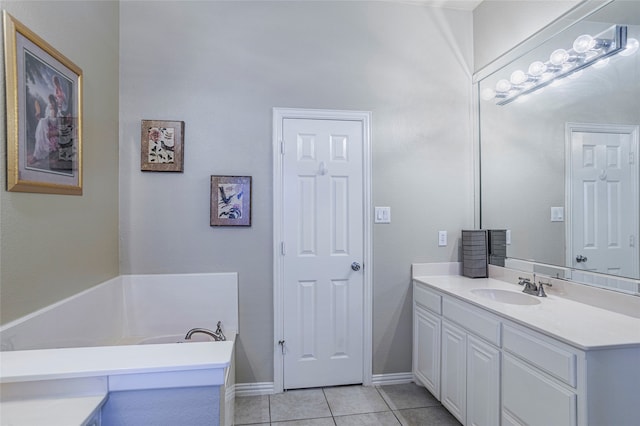 bathroom featuring vanity, a bathing tub, and tile patterned floors