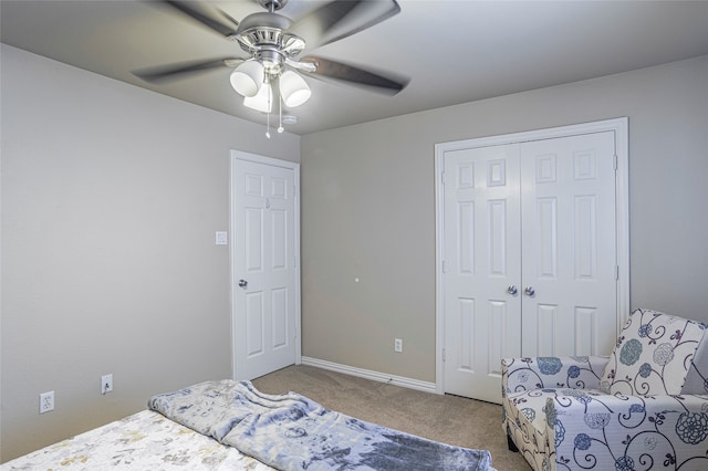 carpeted bedroom featuring a closet and ceiling fan