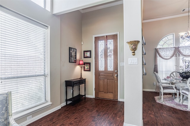 foyer with dark hardwood / wood-style flooring and ornamental molding