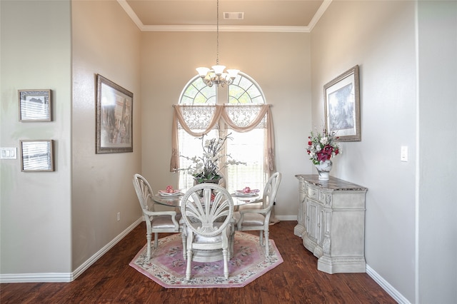 dining space with a notable chandelier, dark hardwood / wood-style flooring, and crown molding