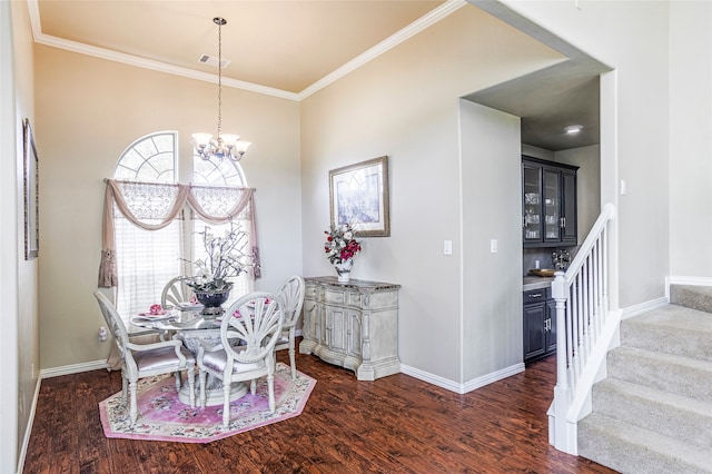 dining room with ornamental molding, an inviting chandelier, and dark wood-type flooring