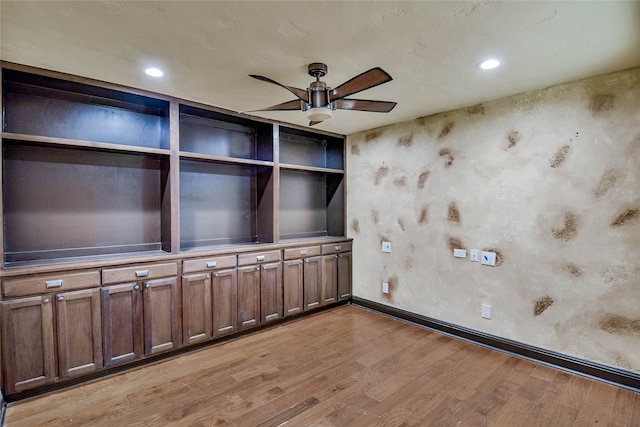 spare room featuring ceiling fan and light hardwood / wood-style floors