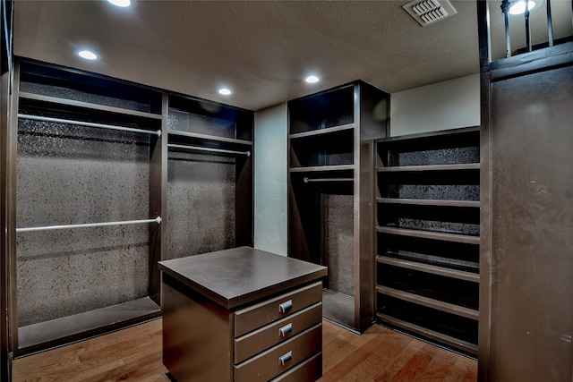 spacious closet featuring light wood-type flooring