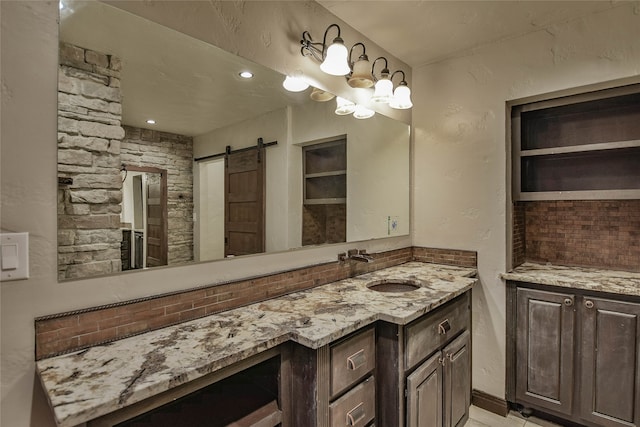 bathroom with vanity and decorative backsplash