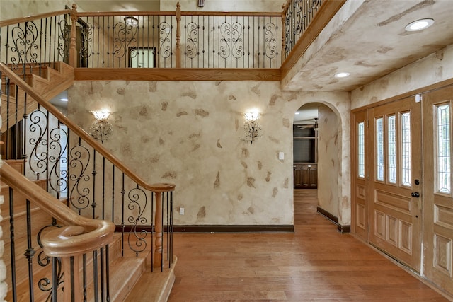 entryway with hardwood / wood-style floors