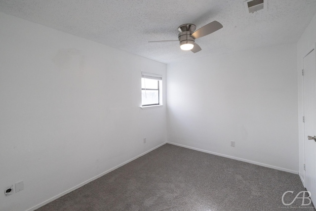 unfurnished room with ceiling fan, a textured ceiling, and carpet floors