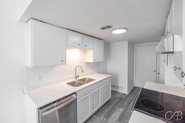 kitchen featuring dishwasher, dark hardwood / wood-style floors, sink, a textured ceiling, and white cabinets