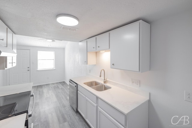 kitchen with white cabinetry, sink, a textured ceiling, and dishwasher