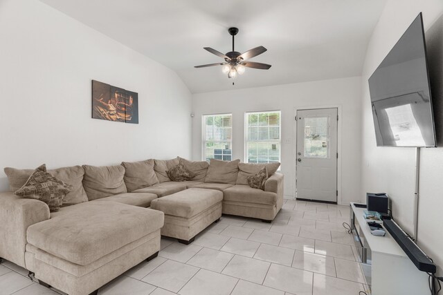 tiled living room with lofted ceiling and ceiling fan