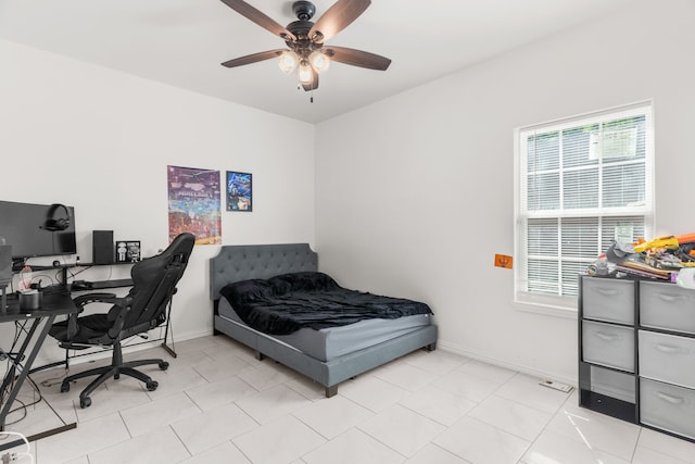 tiled bedroom with ceiling fan