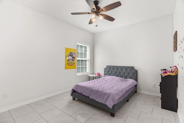 tiled bedroom with ceiling fan