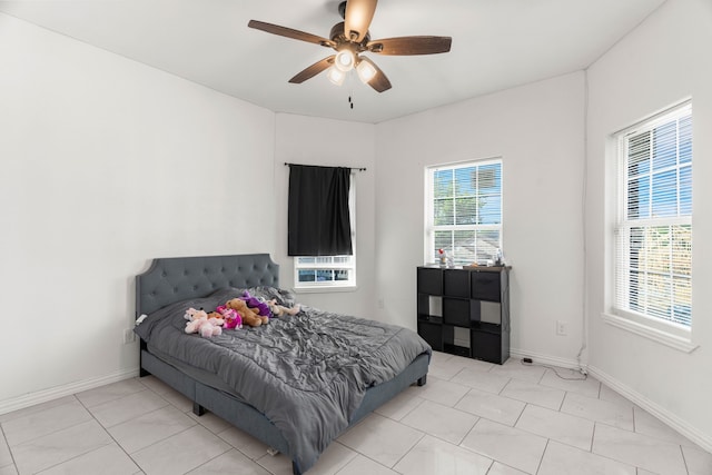 tiled bedroom with ceiling fan