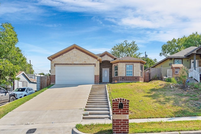 view of front of home featuring a garage and a front lawn