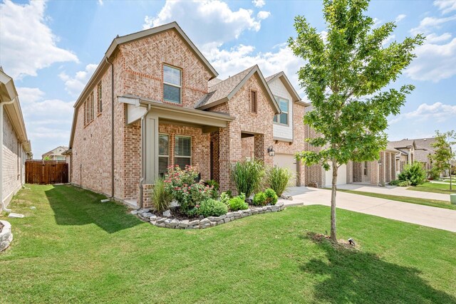 view of front of house featuring a garage and a front yard