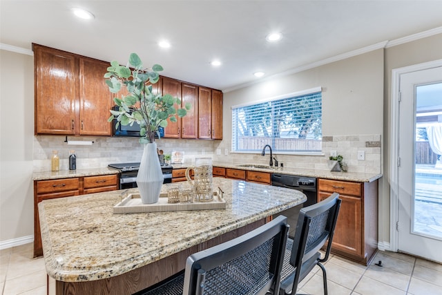 kitchen with a healthy amount of sunlight, tasteful backsplash, and sink