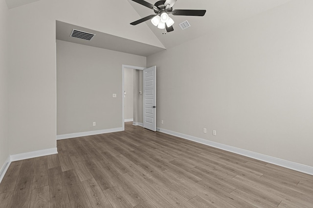 spare room featuring ceiling fan, high vaulted ceiling, and light hardwood / wood-style floors